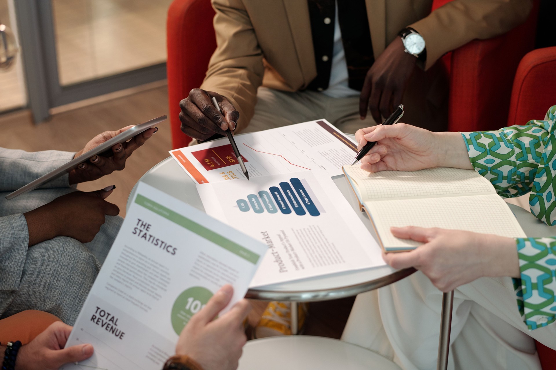 Team Members Analyzing Data and Statistics Together